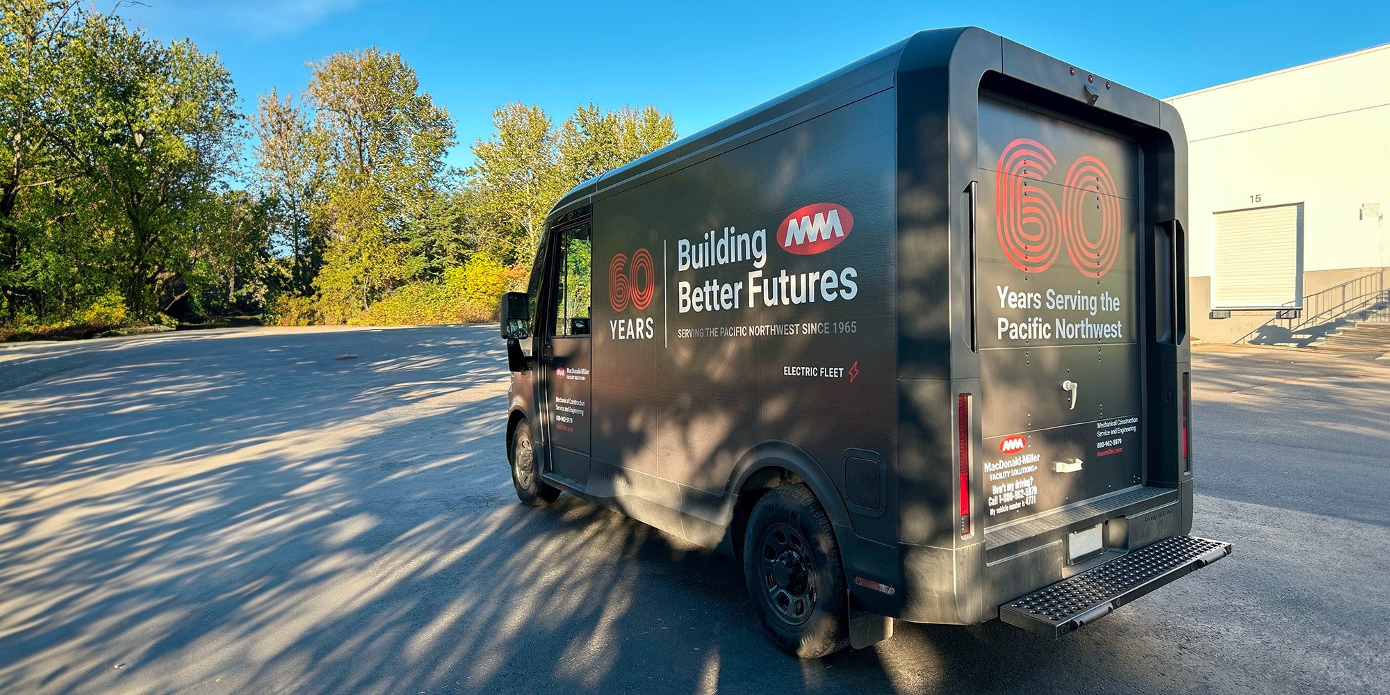 A Chevrolet Brightdrop with Macdonald Miller branding, viewed from the rear