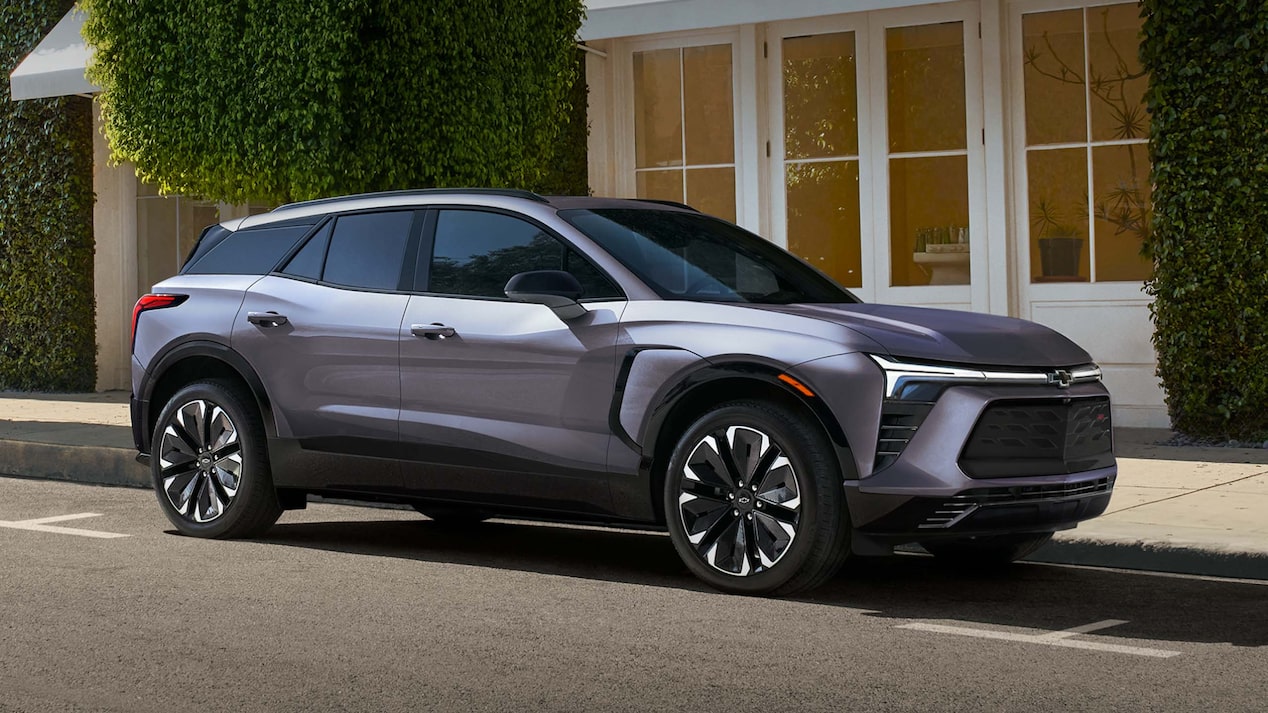 A 2025 Chevrolet Blazer EV, in side profile, parked in front of a business