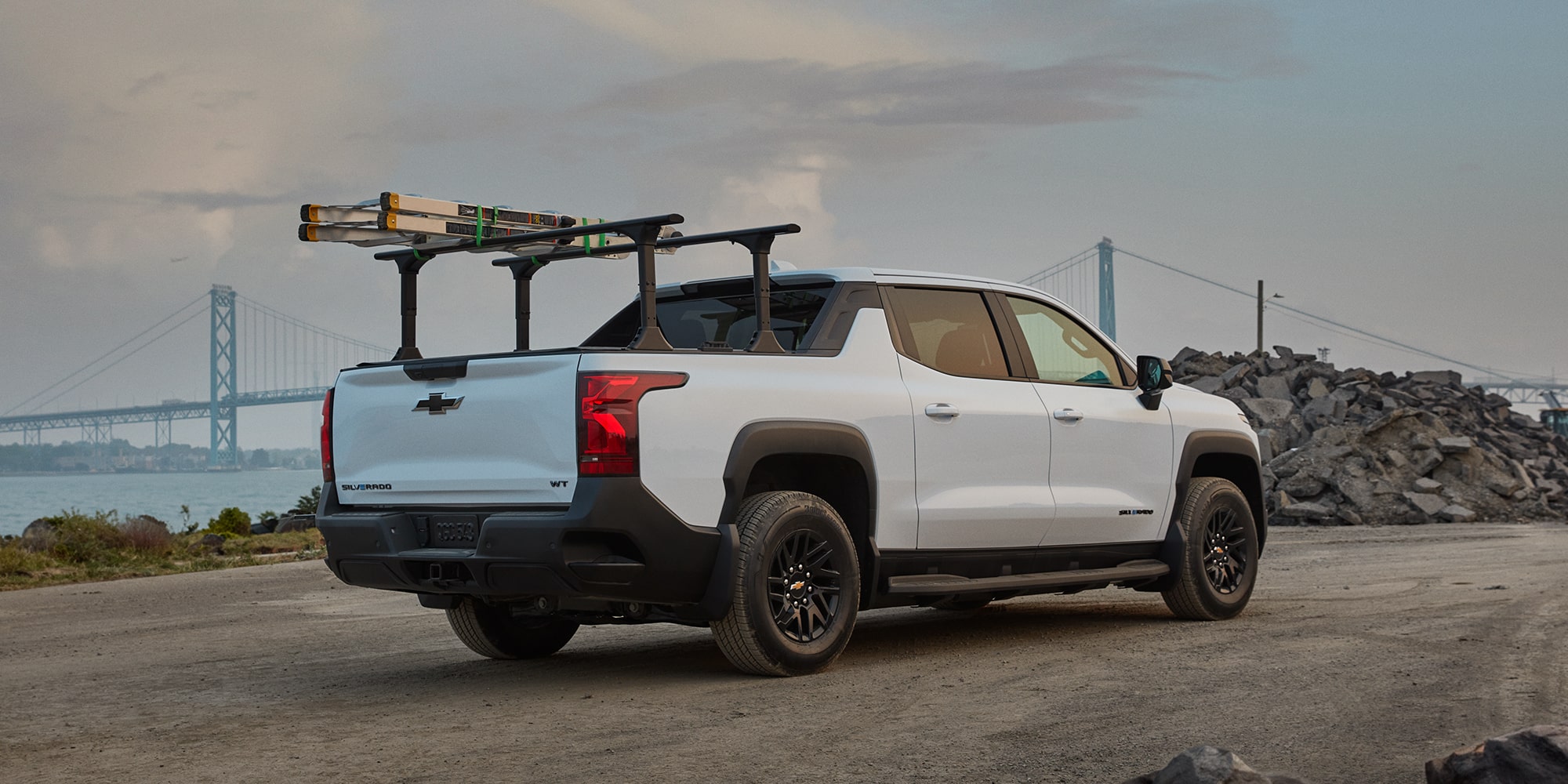 A white 2026 Chevrolet Silverado EV viewed from the rear