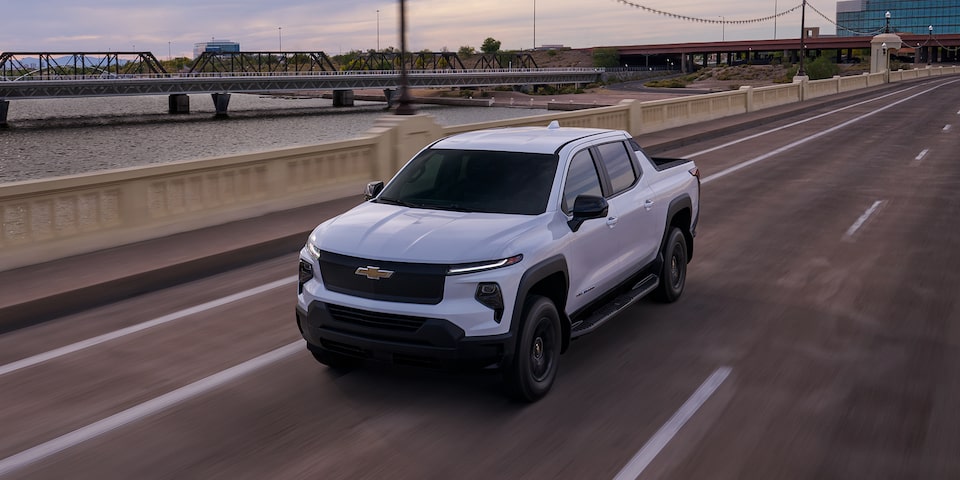 2026 Chevrolet Silverado EV driving down a bridge