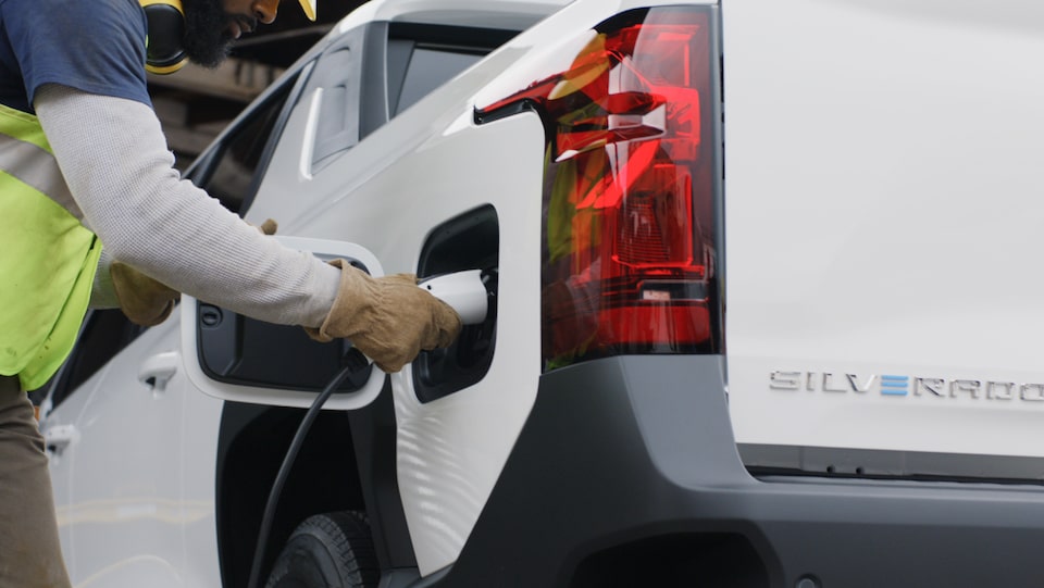 An exterior closeup shot of the charging port for the 2024 Silverado EV.