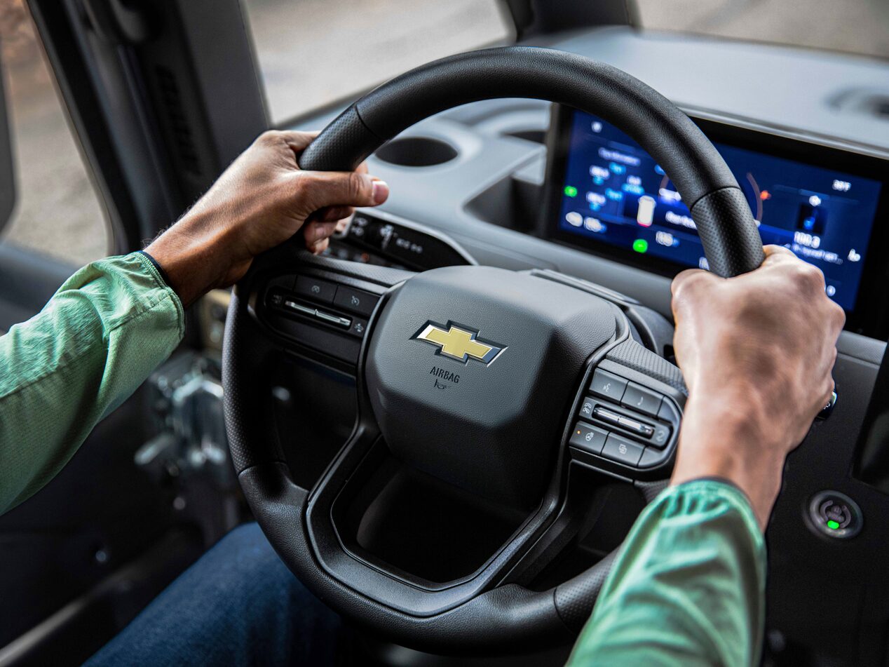 A closeup interior shot of the steering wheel for the 2024 Chevrolet Brightdrop