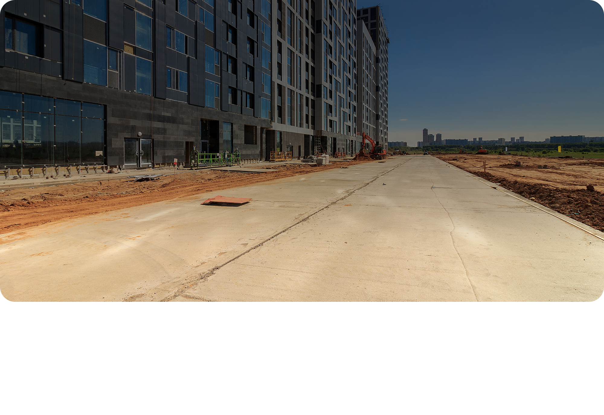 A road with new construction along side it.