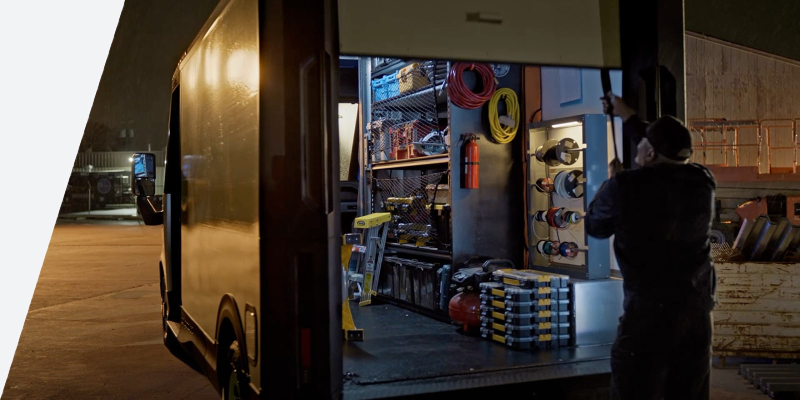 The back of an upfitted Brightdrop being oppened at night