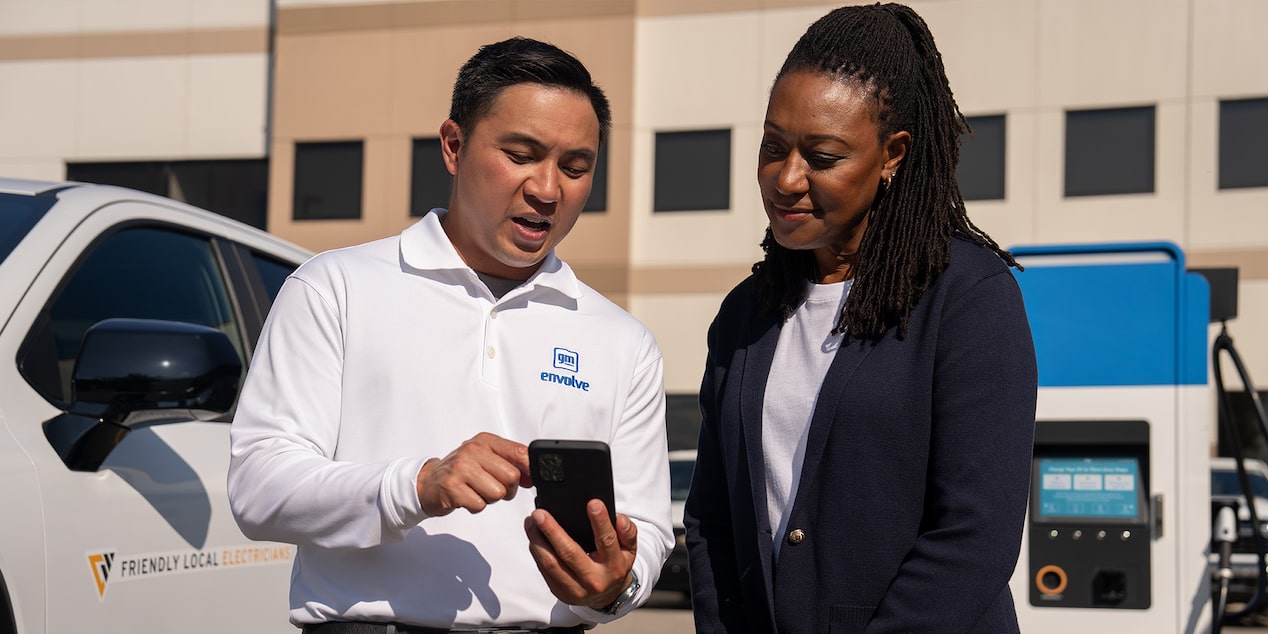 A GM Envolve associate showing how to view telematics data on their phone app.