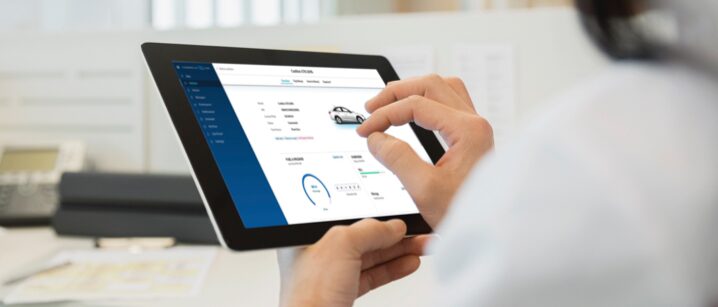 Woman using OnStar Vehicle Insights