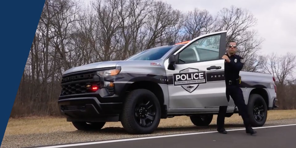 A Police Officer Stepping Out of His Chevrolet Silverado PPV