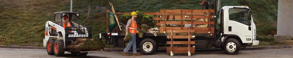 GM Fleet Commercial Truck with two construction workers shoveling - wideview